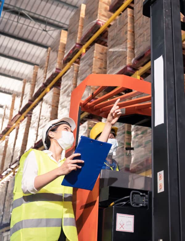asian-female-worker-with-safety-vest-helmet