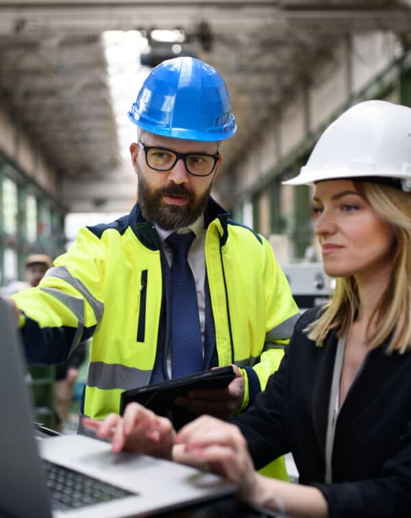 male-and-female-industrial-engineers-discussing-fa-2024-10-19-23-15-59-utc-1-600x756